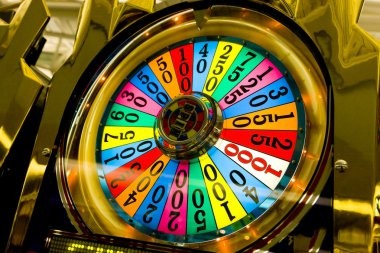 Live dealer revealing community cards in Texas Hold'em Bonus
